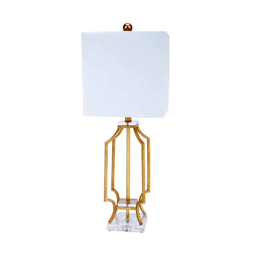 Elegant gold metal table lamp with sculpted openwork base, clear acrylic foundation, and square white fabric shade, luxury modern decorative lighting for living rooms, bedrooms, entryway consoles, and upscale interior décor.