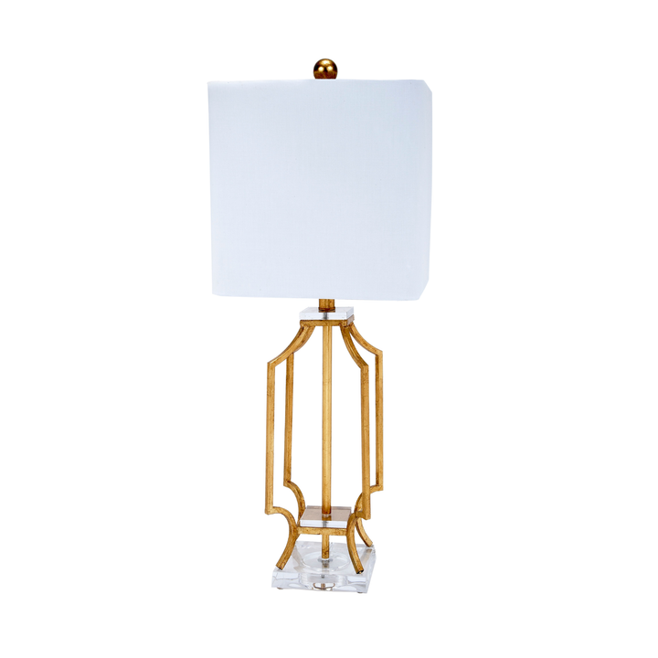 Elegant gold metal table lamp with sculpted openwork base, clear acrylic foundation, and square white fabric shade, luxury modern decorative lighting for living rooms, bedrooms, entryway consoles, and upscale interior décor.