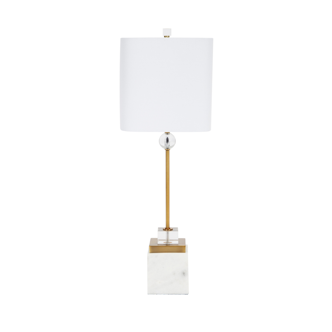 Modern table lamp with white rectangular shade, gold and crystal stem, and white marble base on white background