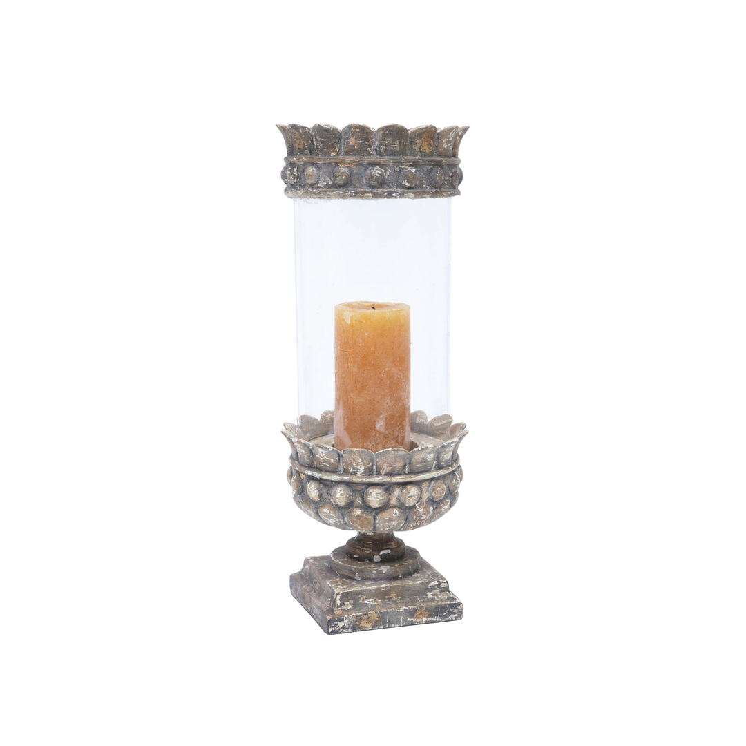 Vintage metal and glass hurricane candle holder with distressed finish and pillar candle on white background