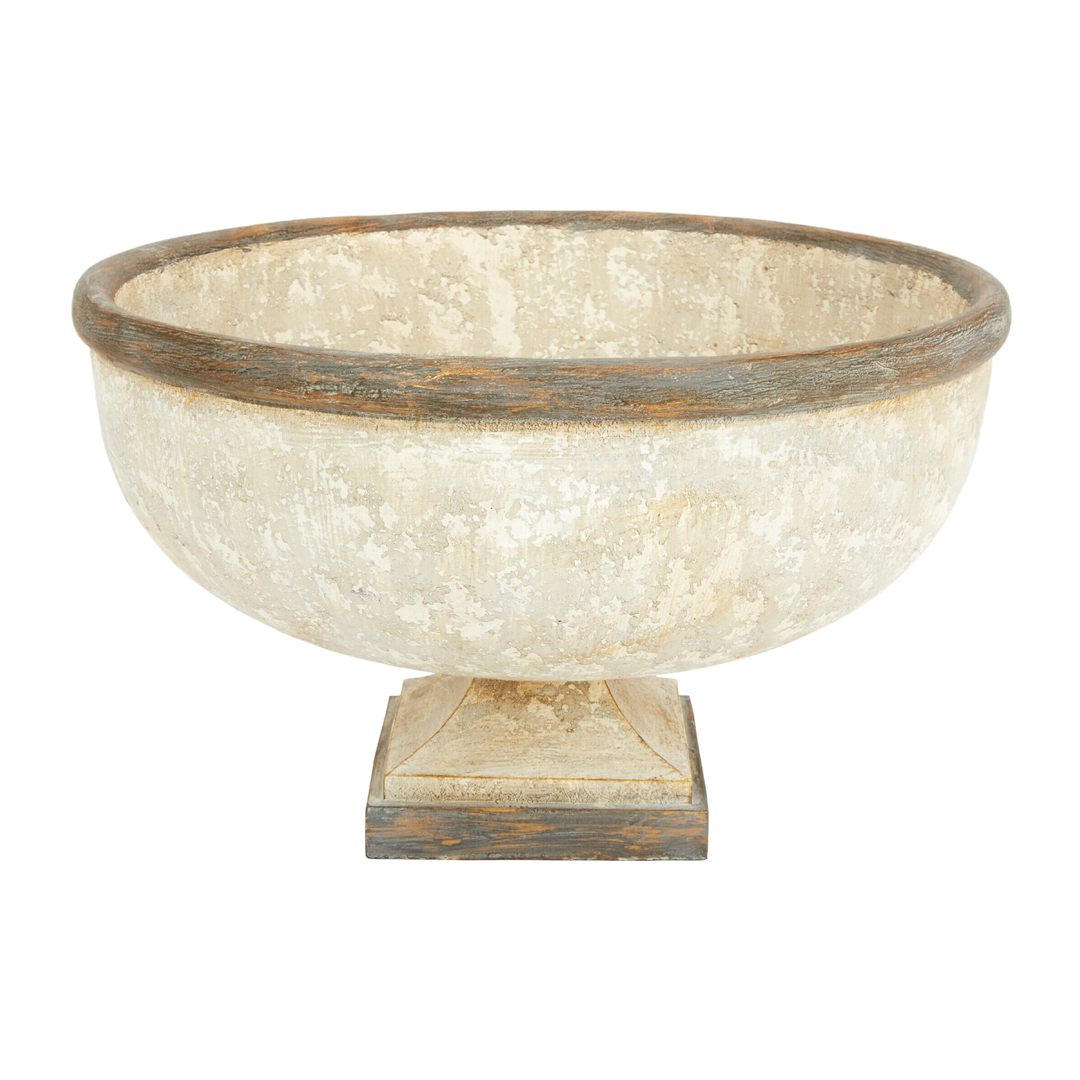 Distressed antique pedestal bowl with weathered cream finish and rustic wood trim on white background