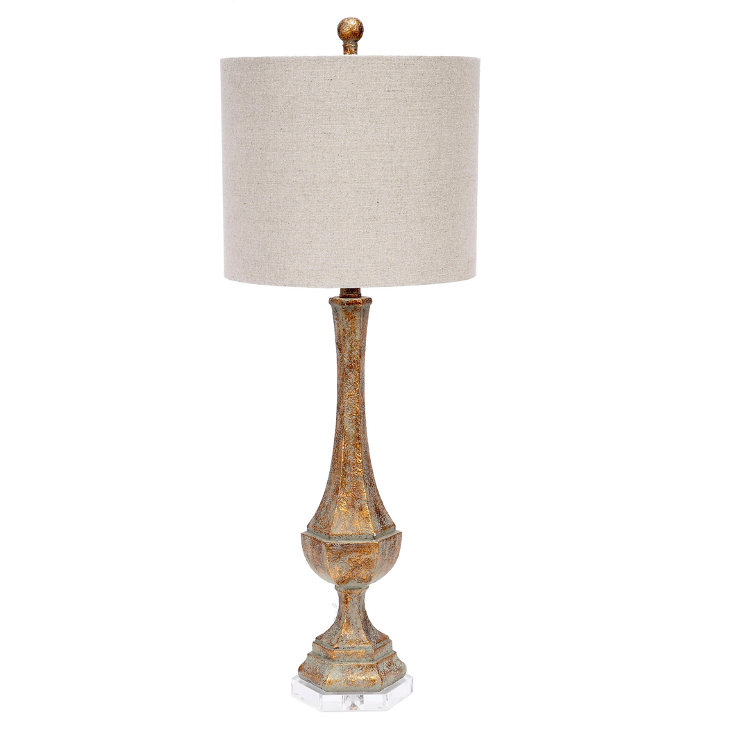 Aged gold table lamp featuring a lucite base and a soft linen shade, perfect for adding a touch of modern elegance to any room.