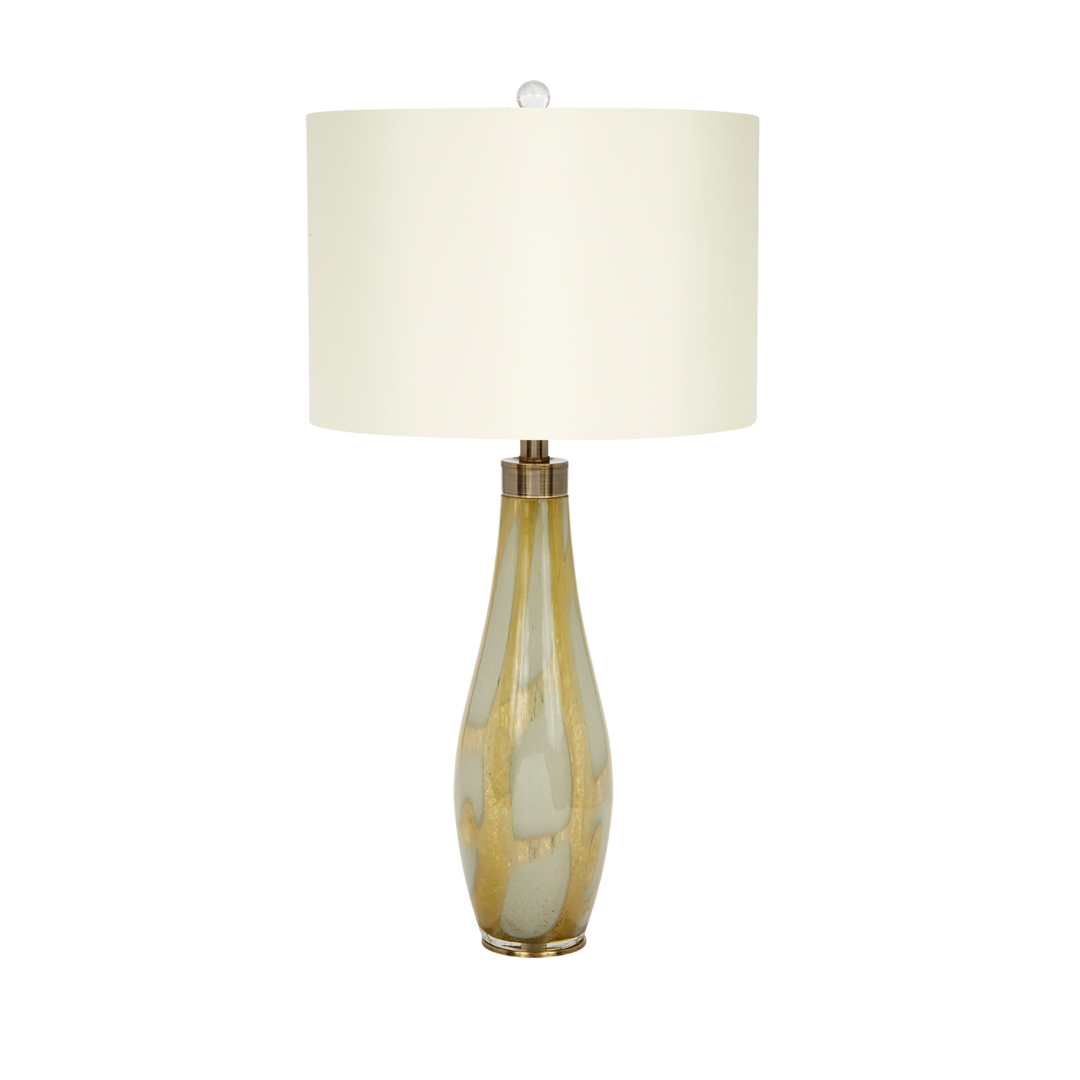 Modern teardrop glass table lamp with gold and champagne metallic finish, round cream fabric shade, luxury contemporary lighting décor for living rooms, bedrooms, and elegant interior spaces.