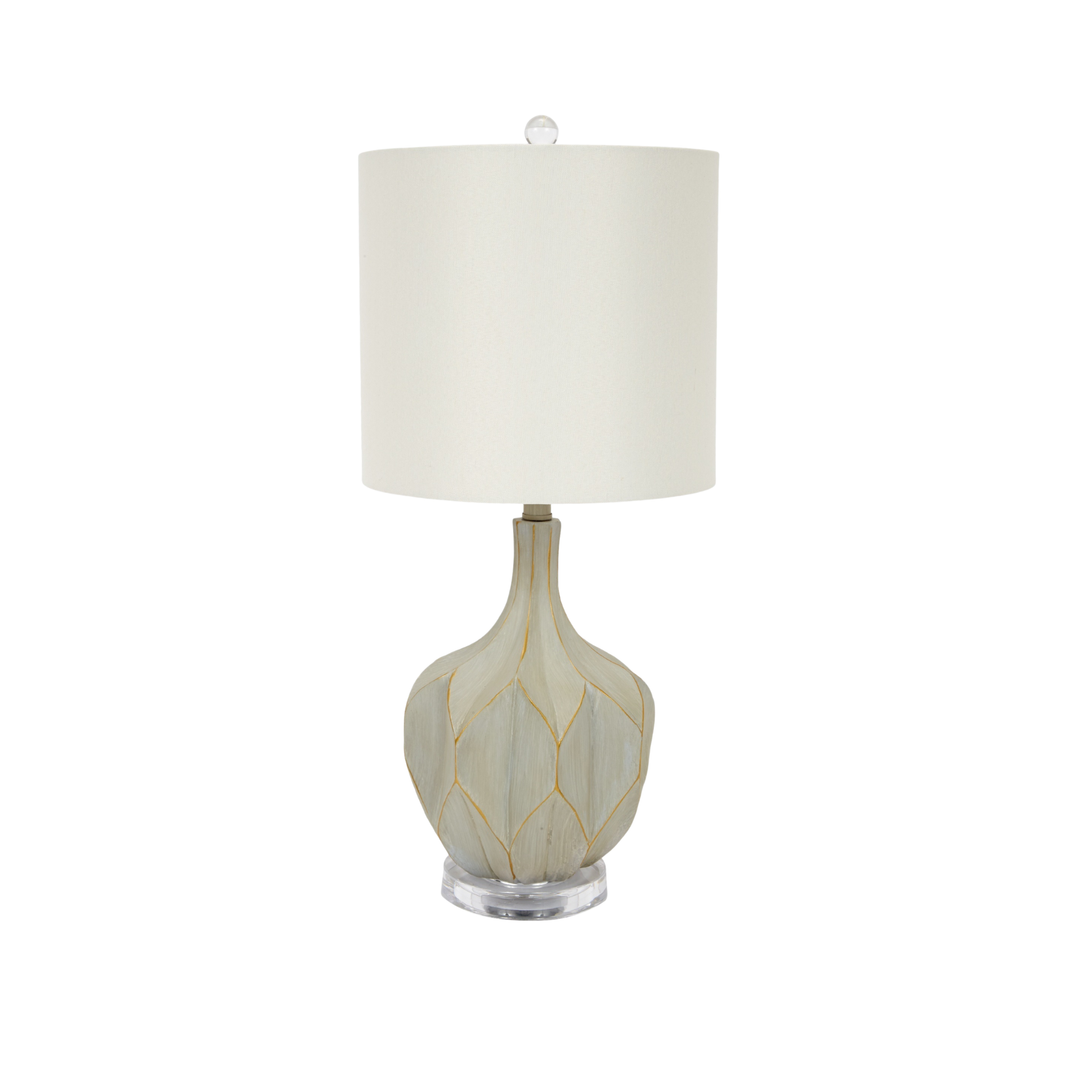 Textured gourd-shape table lamp with neutral drum shade and carved leaf pattern base on white background