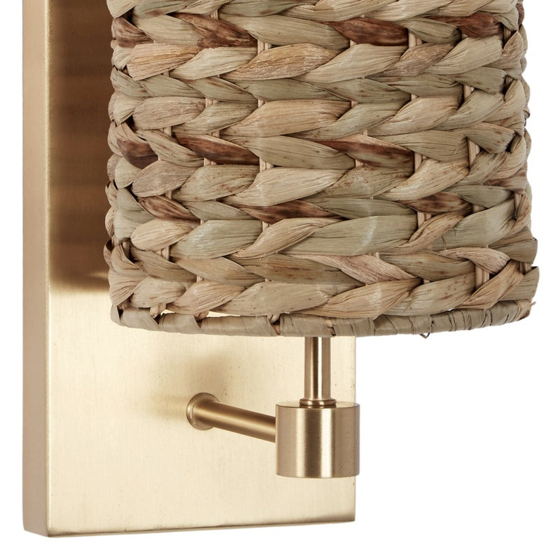 Gold wall sconce with woven water hyacinth shade and metal wall mount